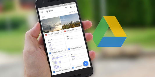 Hand holding smartphone showing Google Drive app with files and photos, Google Drive logo in background